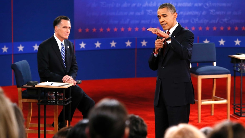 Mitt Romney listens as Barack Obama speaks during the second presidential debate.