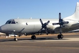 A RAAF aircraft returns after searching in the Indian Ocean