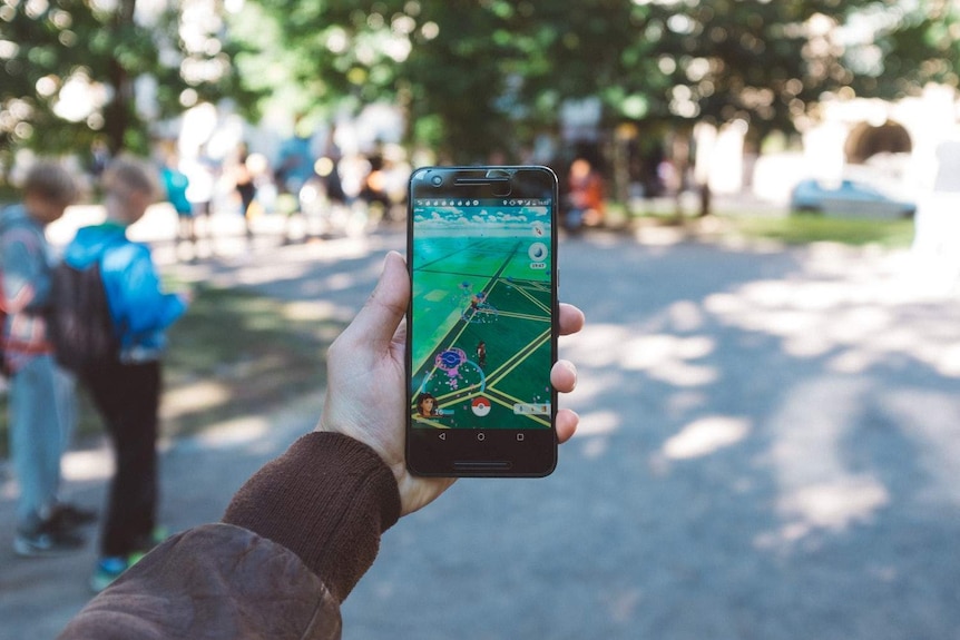 Pokémon Go is seen on the screen of a mobile phone.
