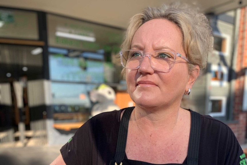 Sally Cannon wears a black apron with the words 'Apollo Bay Bakery' on it.