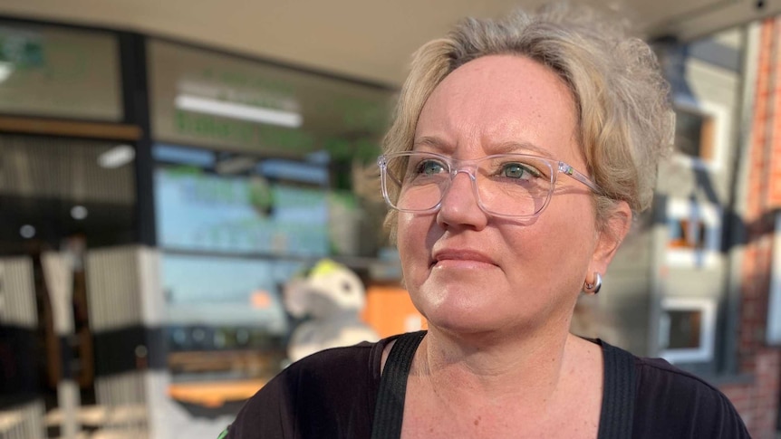 Sally Cannon wears a black apron with the words 'Apollo Bay Bakery' on it.