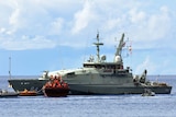 A boat carrying asylum seekers is escorted to Christmas Island (file)