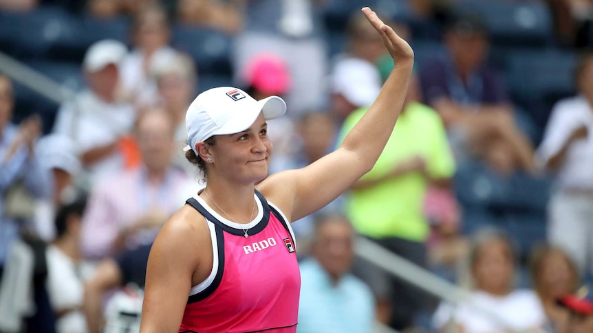 A tennis player waves to the crowd after she wins a match at the US Open.