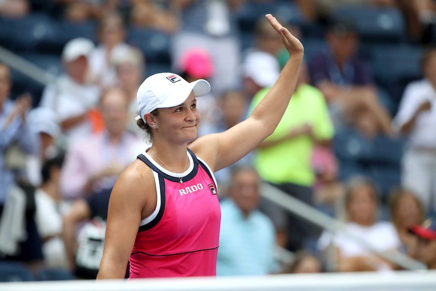 A tennis player waves to the crowd after she wins a match at the US Open.