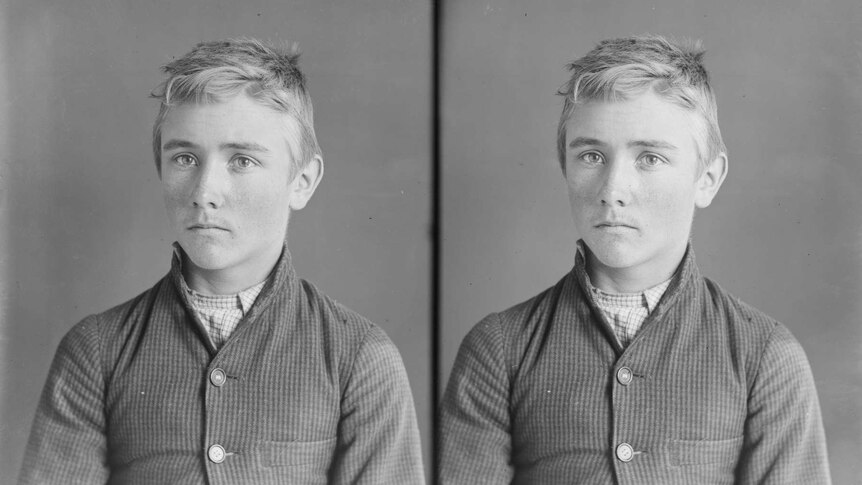 Black and white court/police photograph of a teenaged boy from the 1800s.