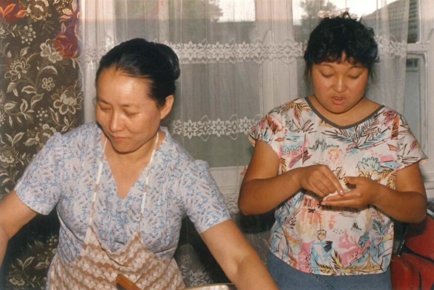 Rufina Djo (right) and her mother making dumplings.