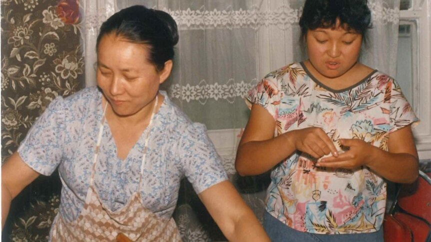 Rufina Djo (right) and her mother making dumplings.