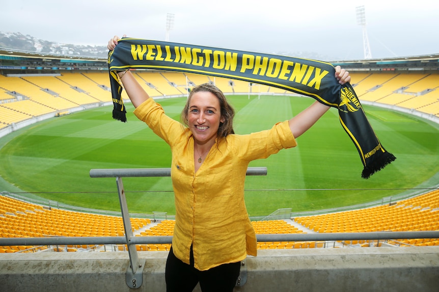 Football Fern Annalie Longo poses with Wellington Phoenix scarf.