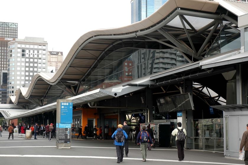 People walk along the concourse outside Southern Cross Station