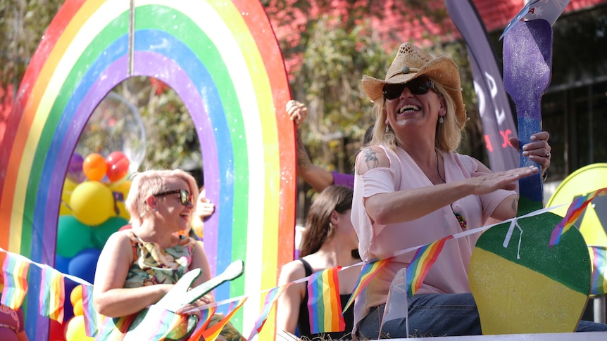 Beccy Cole and wife Libby O'Donovan on an LGBT pride float