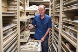 Patrick Couper standing in the collections section of the Queensland Museum
