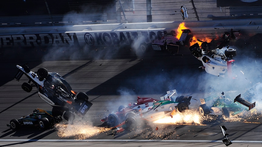 The cars of Dan Wheldon and Pippa Mann fly in the air during the Las Vegas Indy 300.
