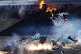 The cars of Dan Wheldon and Pippa Mann fly in the air during the Las Vegas Indy 300.