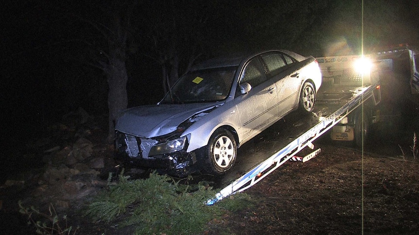 A car is pulled from the water in Ellenbrook. August 7, 2014.