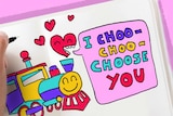 A hand drawing in a Valentine's Day card with a train saying 'I choo-choo-choose you'