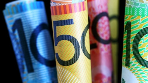 File photo of rolled-up Australian $10, $20, $50 and $100 dollar notes.