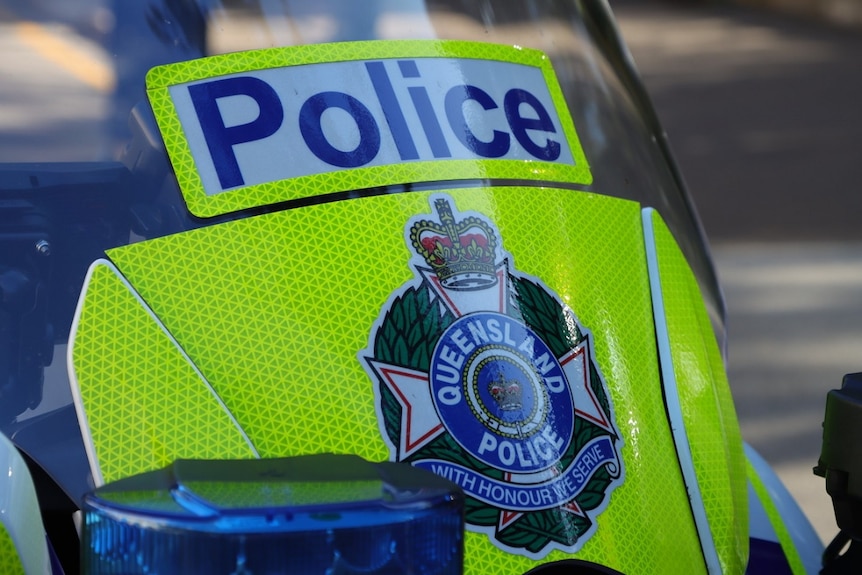 Close up of Qld police logo on front of motorcycle in Brisbane