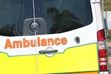 An ACT ambulance driving along a road *good generic
