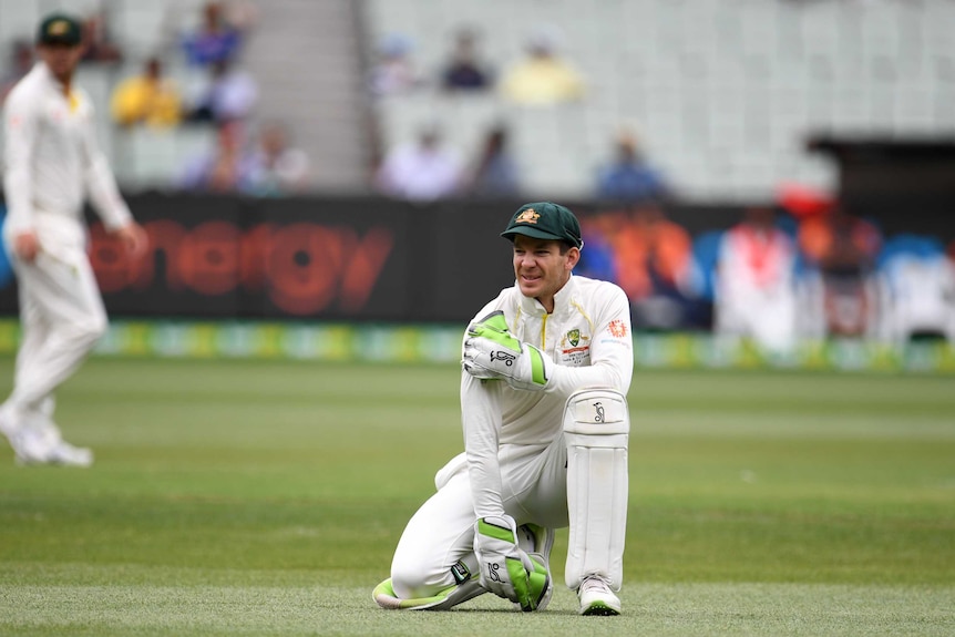 Australia's Tim Paine reacts after a dropped catch against India on day four