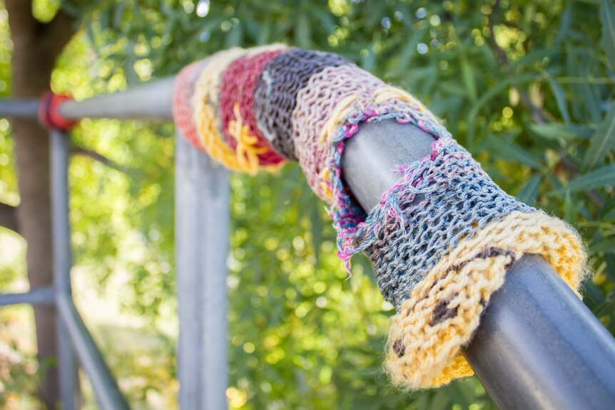 Yarn bombing on a railing in  Hobart