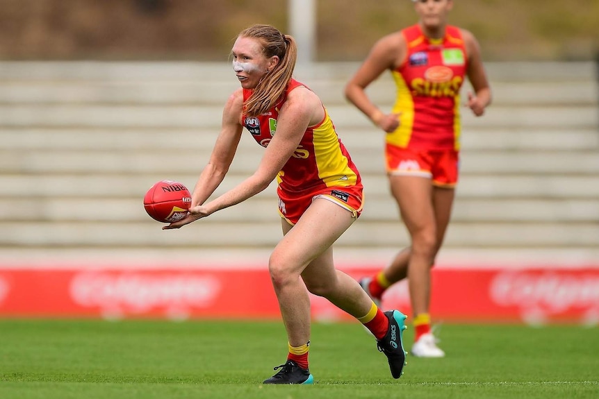 AFLW Gold Coast Suns player Dr Tia Ernst on the field.