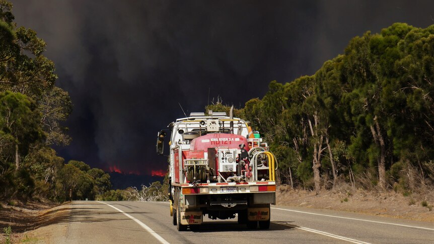 A fire truck heading towards a bushfire 