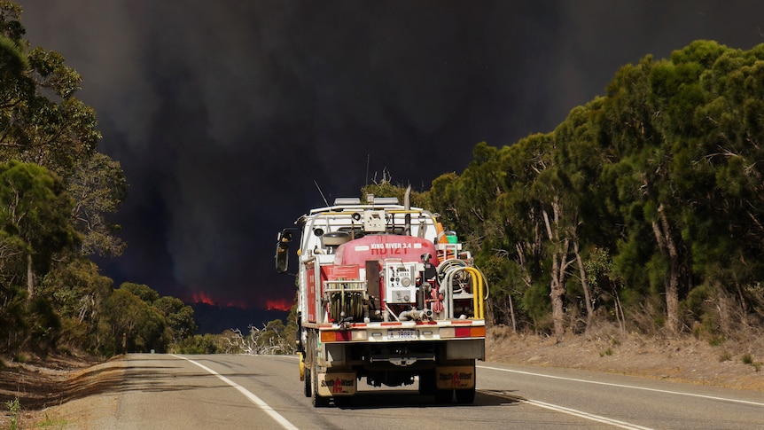 A fire truck heading towards a bushfire 