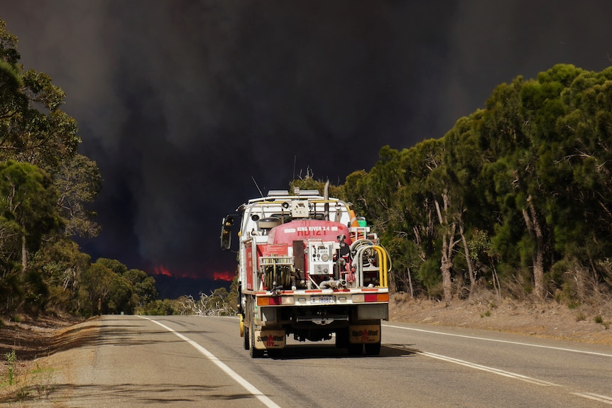 A fire truck heading towards a bushfire 