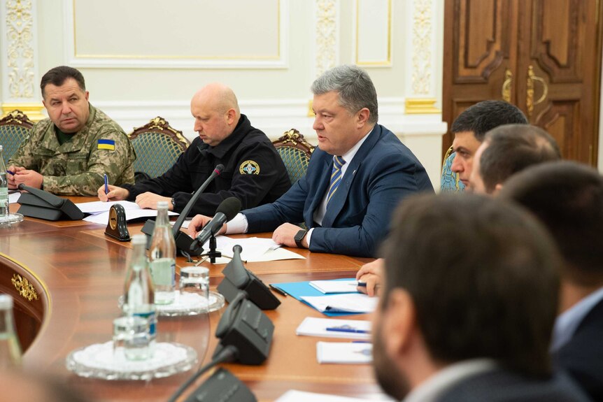 Ukrainian President Petro Poroshenko chairs a meeting with members of the National Security Council in Kiev, Ukraine