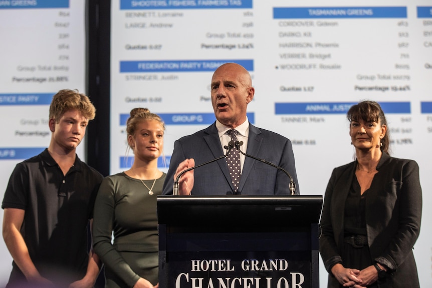 Premier Peter Gutwein on stage with his family on the election night.