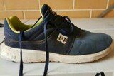 Injured man's missing shoe