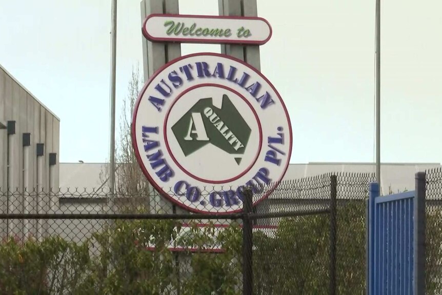 A sign in front of an abattoir reading 'Welcome to Australian Lamb Co. Group"