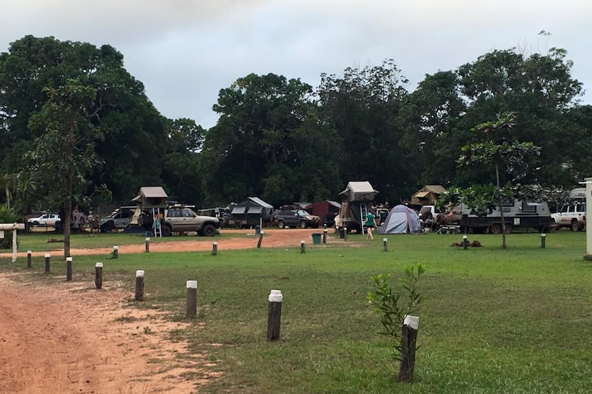 Busy campground full of four-wheel drives, tents and caravans