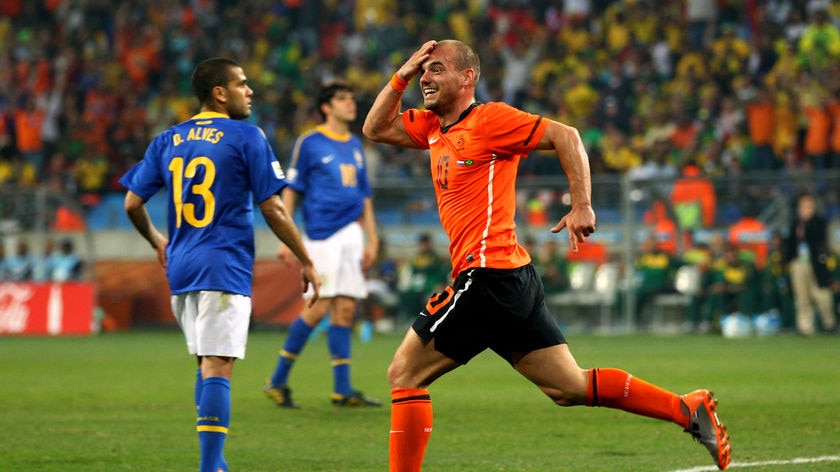 Orange is the colour: Wesley Sneijder's free header knocked tournament-favourites Brazil out of the 'Cup.
