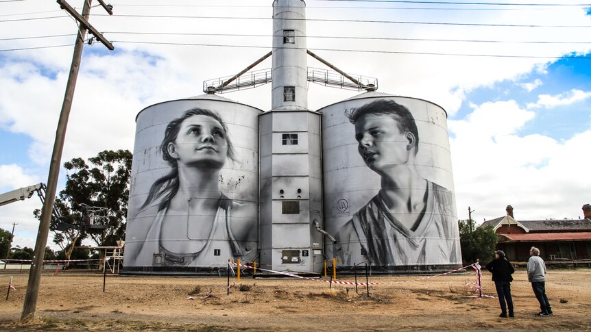 Tourists Carol and Brenton Koch from South Australia gaze up at the silo art.