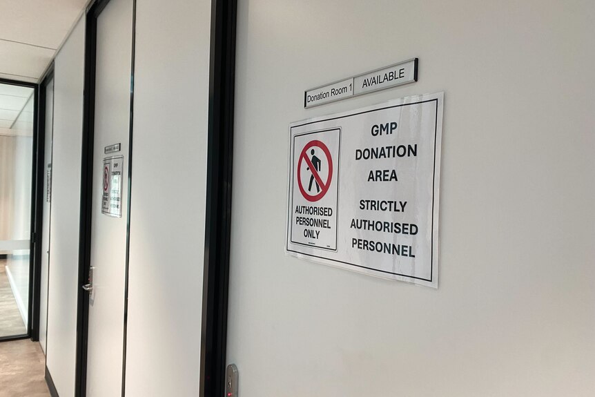 A door with 'donation room 1' and a sign that says 'GMP Donation Area. Strictly Authorised Personnel' 