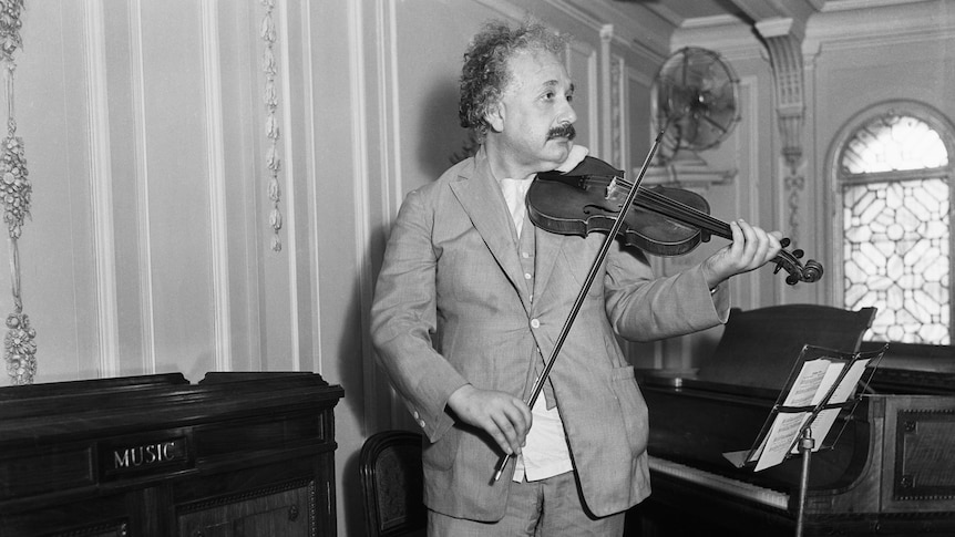 Einstein in his lounge room playing violin