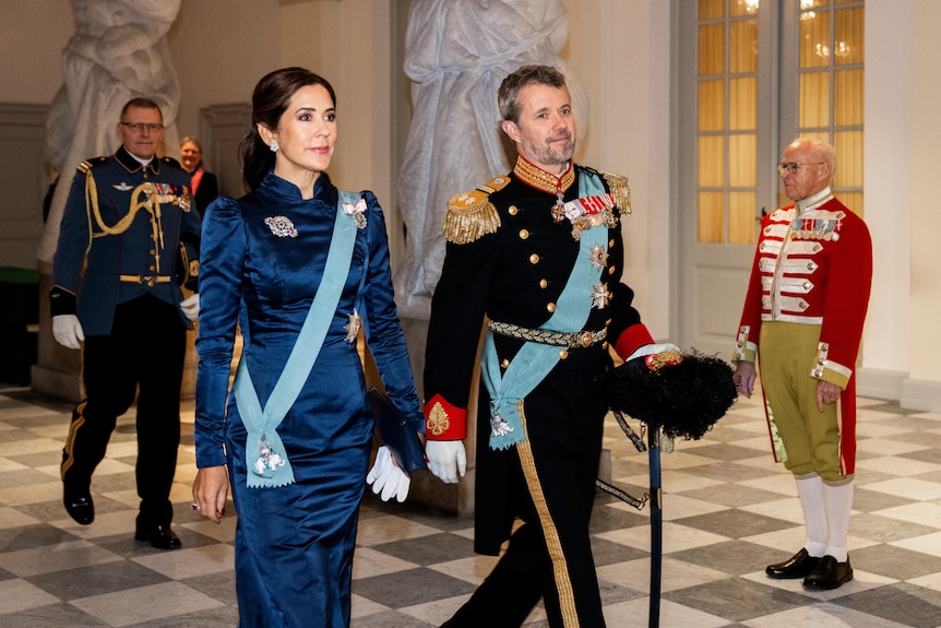 Princess Mary and Prince Frederik walk side by side.