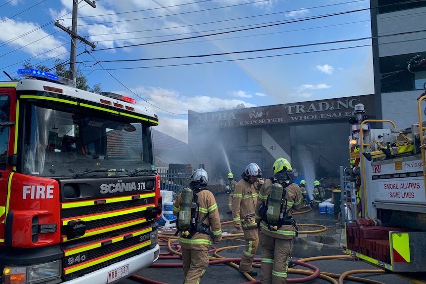 Firefighters extinguishing a blaze at a factory