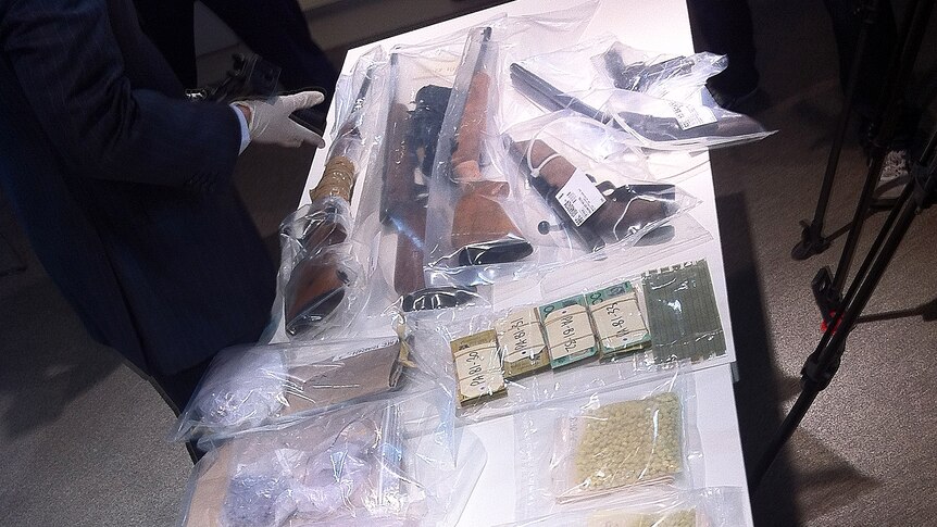 Drugs and firearms seized by authorities have been shown to the media