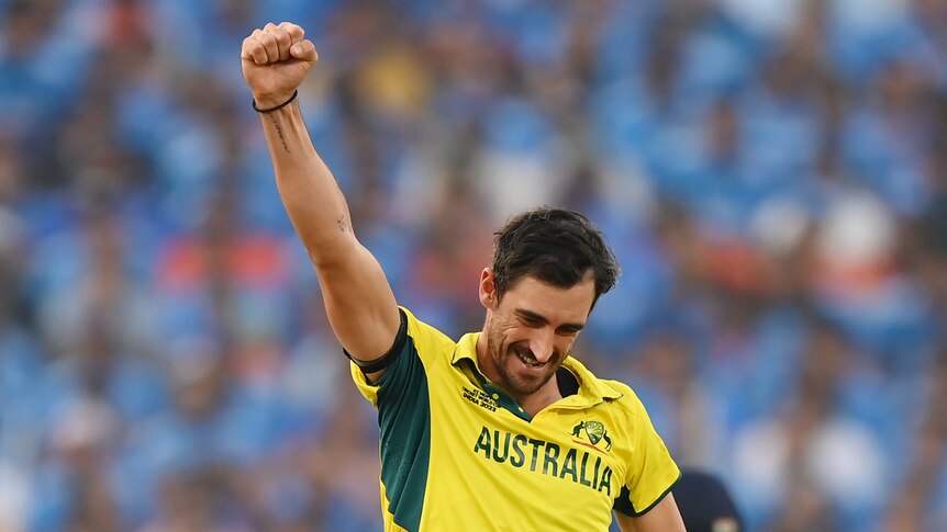Mitch Starc holds up his hand