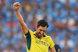 Mitch Starc holds up his hand