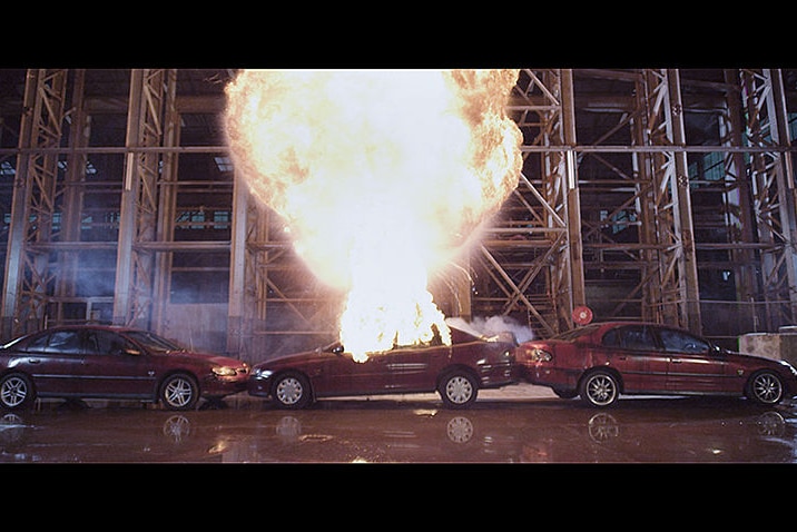 Three Holden Commodores being destroyed