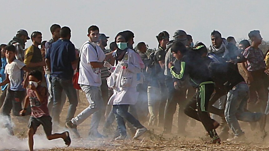 Razan Najjar is seen before being shot in her chest by Israeli troops while running with protesters.