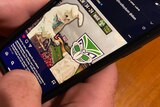 A phone displays an NRL meme featuring someone dressed in an Easter bunny costume.