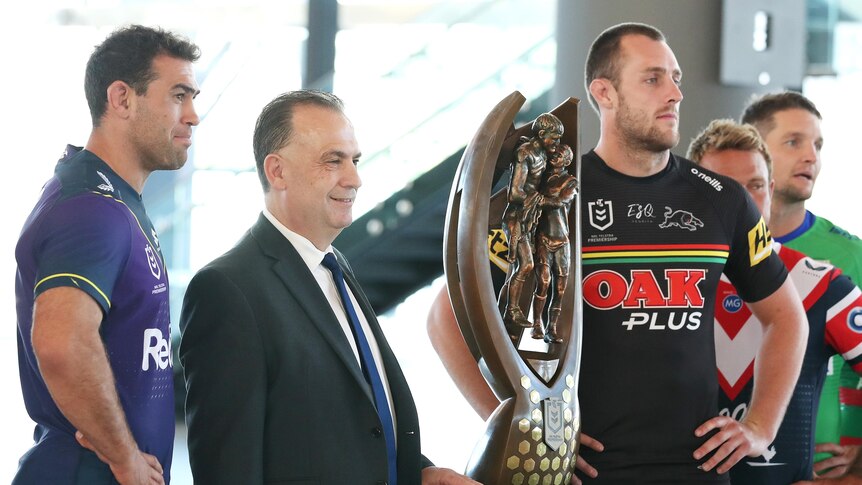 ARL chairman Peter V'landys and NRL captains with the premiership trophy at the 2021 season launch.