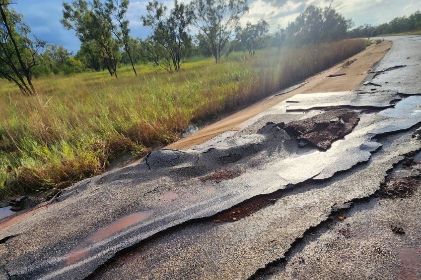 A road which has been extremely damaged by floodwaters