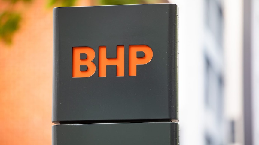 An orange BHP logo on a grey background.