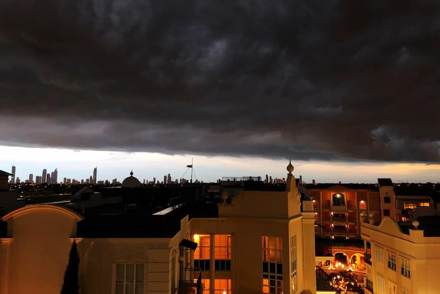 Dark storm clouds brew over Surfers Paradise, looking from Carrara on Queensland's Gold Coast.