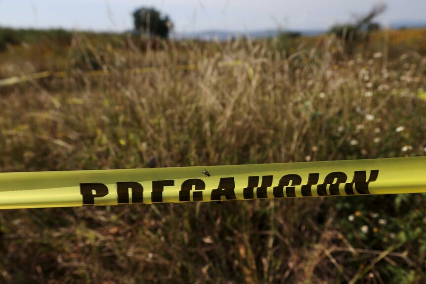 Mexican police tape blocks off burial site
